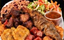 Fritay platter with fried pork, fish, plantains, pikliz and akra